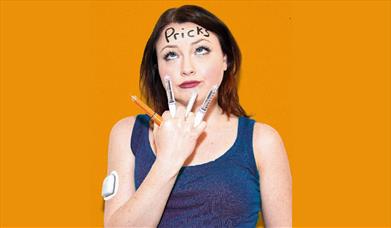 Press shot for Pricks, showing Jade with various diabetes-related items