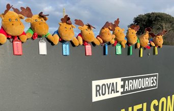 Soft toy reindeer on the Fort Nelson sign