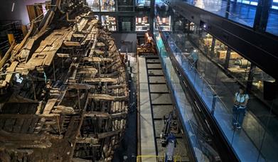 Image of the Mary Rose hull at the museum as seen from above during a Lights Up morning