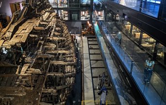 Image of the Mary Rose hull at the museum as seen from above during a Lights Up morning