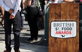 Wooden stand showing the British Street Food awards logo