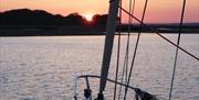 Sunset over the Bow with Solent Yachting