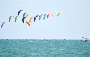 Kite surfing out in the Solent, photograph by Vernon Nash