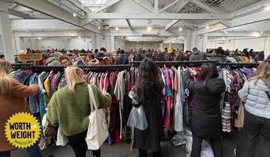 Photograph showing shoppers at a Worth the Weight sale