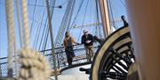 Two people take in the sights on board HMS Warrior