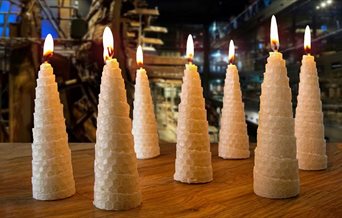 Seven conical candles at The Mary Rose museum