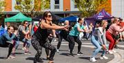 Exercise class taking place at the Sweat Fitness Festival in Gunwharf Quays