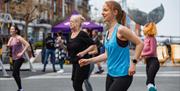 A group moves along with an exercise routine at Gunwharf Quays for the Sweat Festival Portsmouth