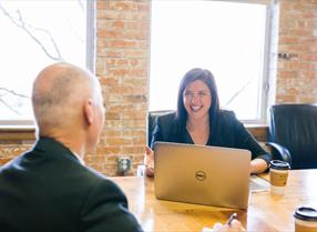 Two professionals having a business meeting in an office