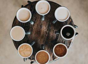 Collection of coffee mugs positioned in a circle