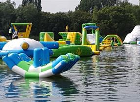 inflatable water park on a lake