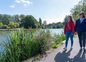 2 girls walking along the Thames