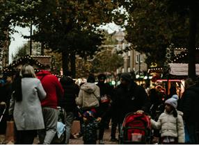 shoppers walking around Broad Street with Christmas decorations