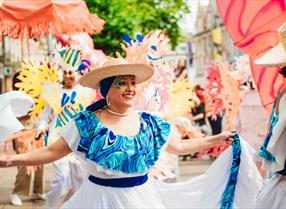 Lady dancing with colourful props