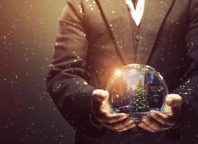 Hands holding a snow globe