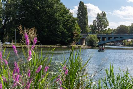 Boat sailing down the River Thames in Reading