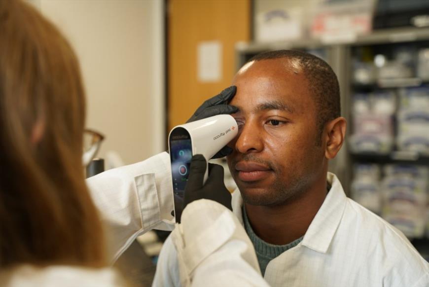 Man having his eye scanned