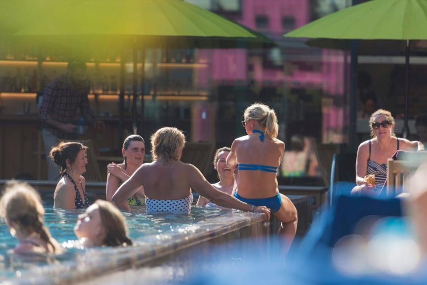 group of swimmers enjoying a sunny day in the water