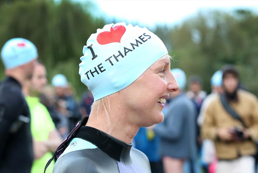 Lady wearing a 'I heart Thames' swimming cap
