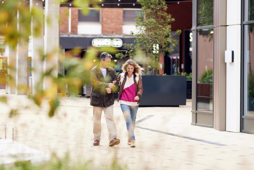 Couple walking down Friar's Walk, Reading