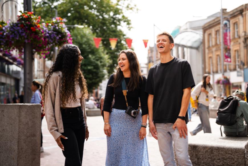 Three friends in town centre