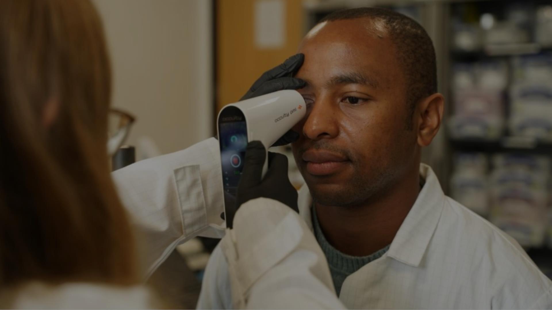 Man having his eye scanned