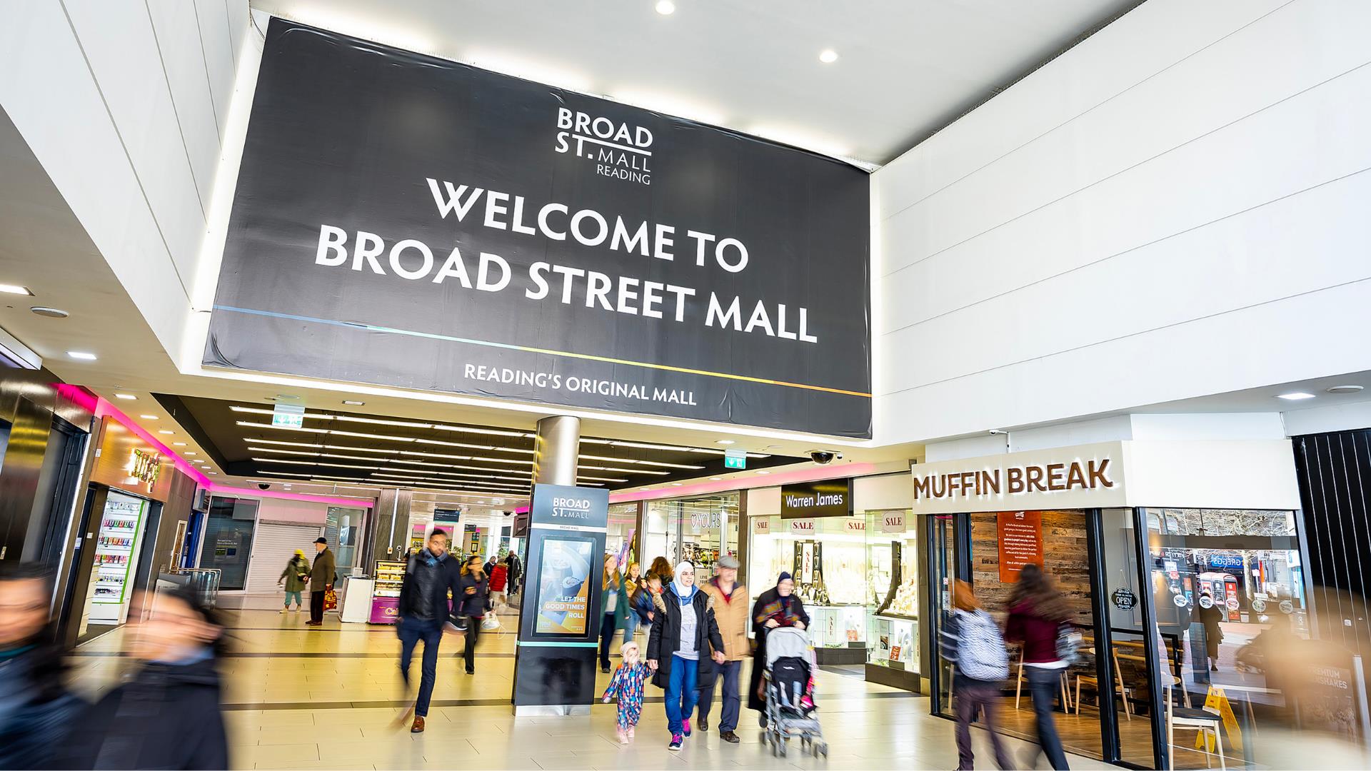 Interior of Broad Street Mall in Reading, with shoppers in front of shops