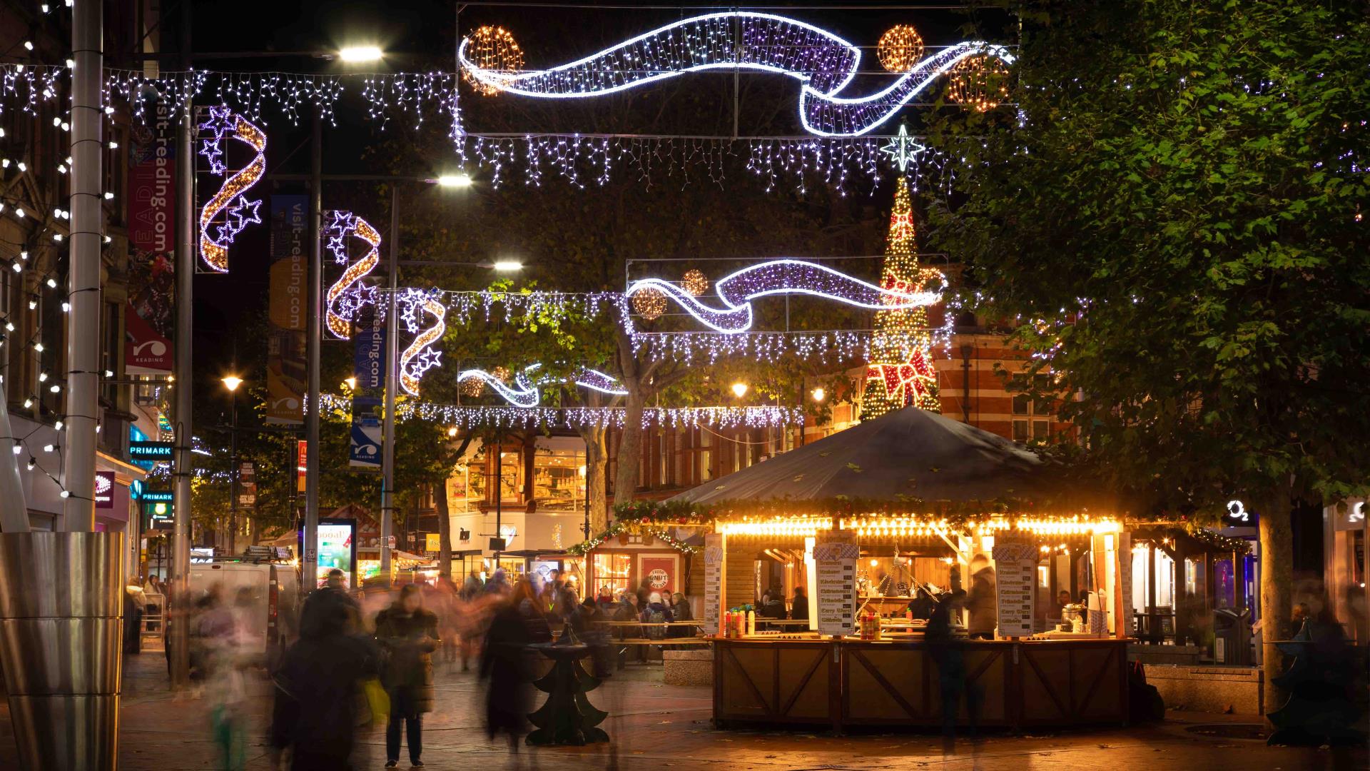 Shoppers walking along Broad Street in Reading at Christmas time