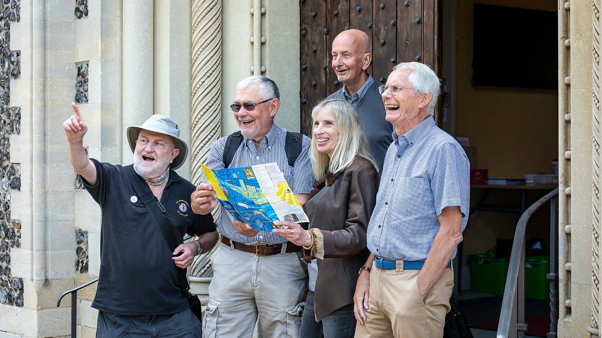 pilgrims on step of St James church