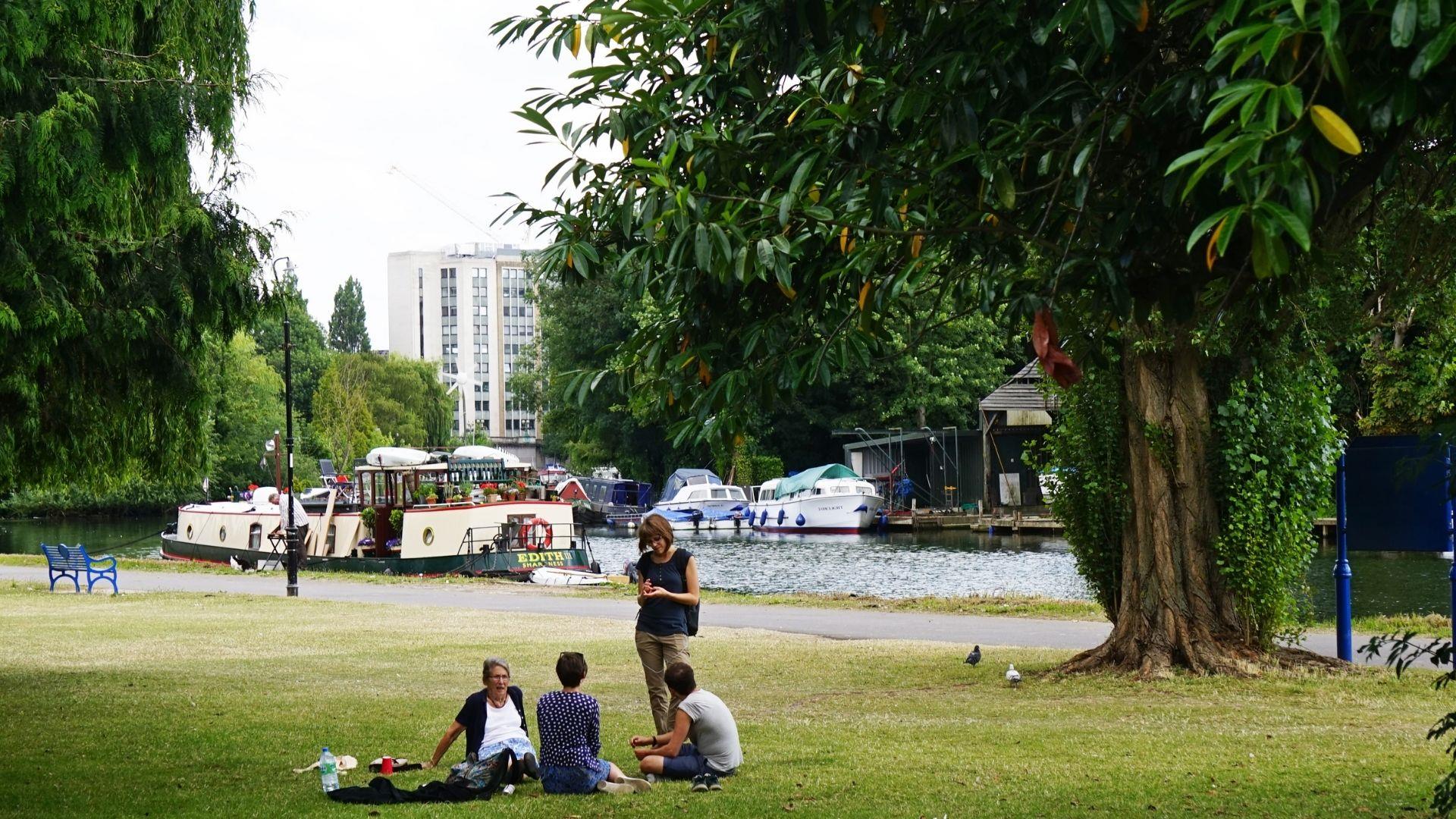 Group of people on the bank of the Thames