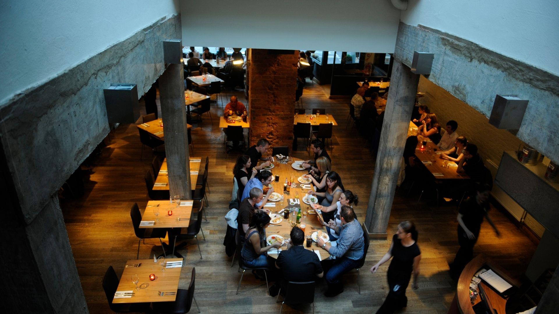 Group of people eating at a table inside Zero Degrees Restaurant in Reading