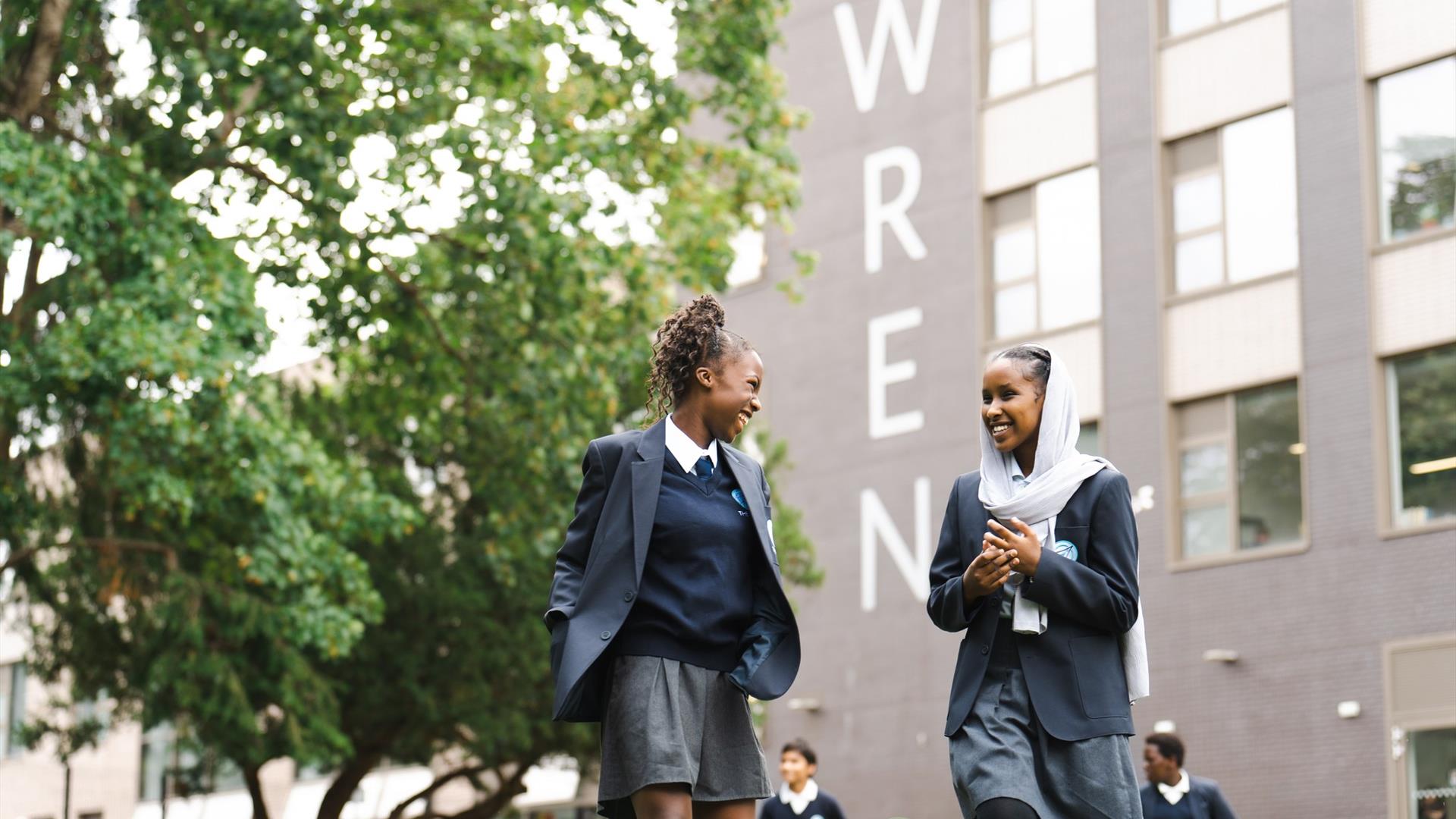 Two girls outside of Wren school
