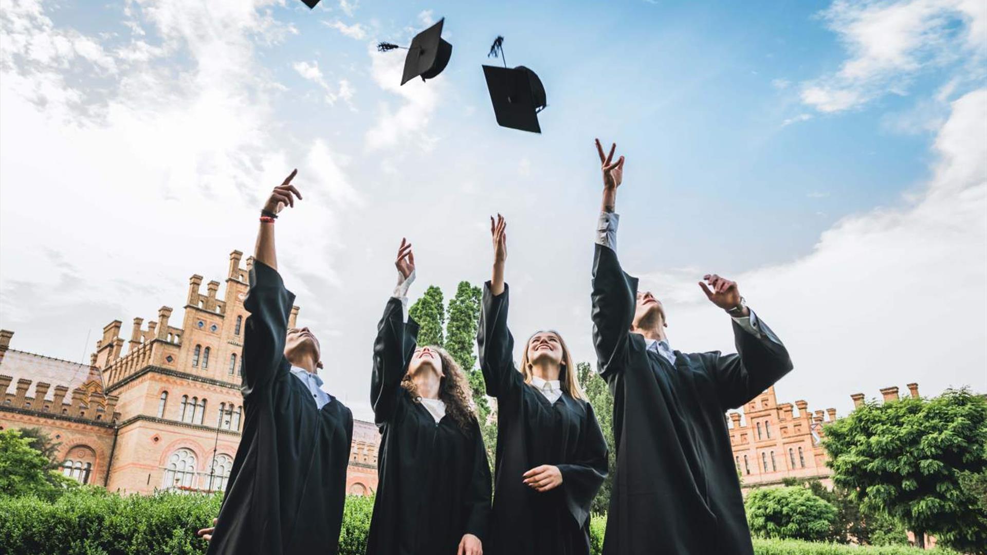 Graduates throwing cap