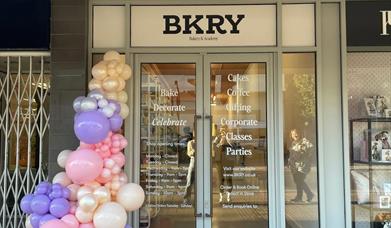 Storefront with balloons outside