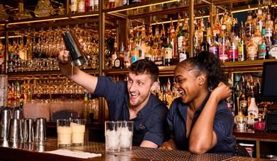 Cocktails being made at the bar