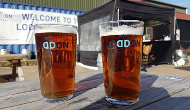 2 pint glasses on a table