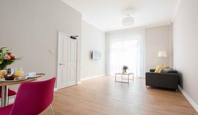 Living room with table, chairs and sofa