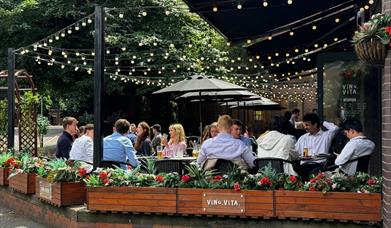Outdoor seating under string lights