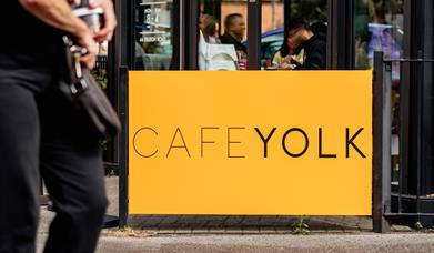 Cafe Yolk yellow sign
