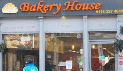 delivery cyclist outside Bakery House