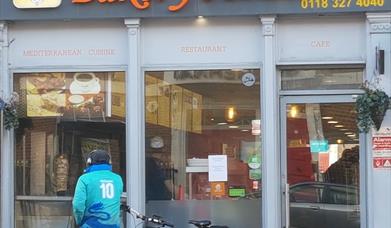 delivery cyclist outside Bakery House