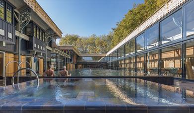 View of length of pool and hot tub