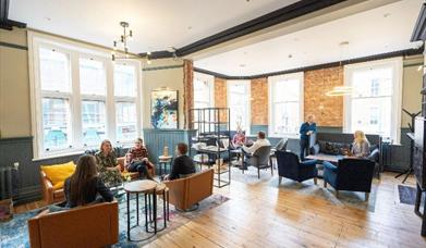 people sitting in informal lounge area