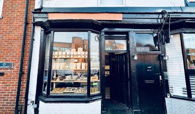 Filter Coffee House exterior, painted black with orange sign