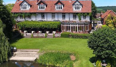 Pond and  lawns in front of hotel