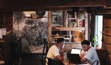 Two men working at a table