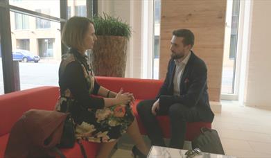 two people sat in reception area