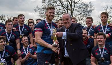 Team receiving a trophy