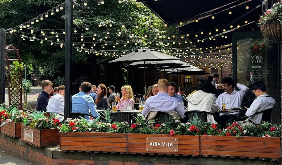 Outdoor seating under string lights