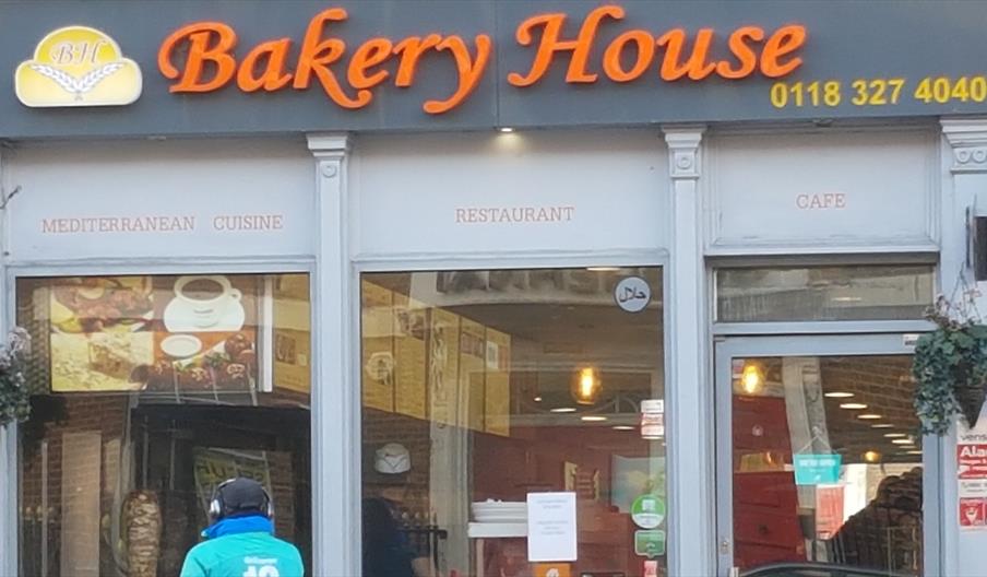 delivery cyclist outside Bakery House